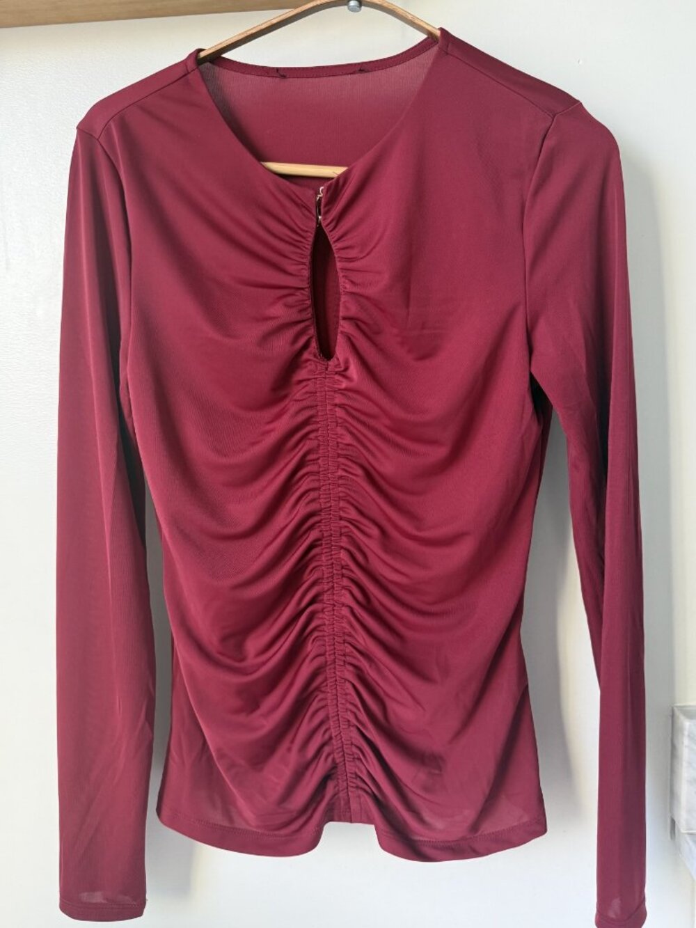 Beautiful berry-colored club shirt with golden clasp